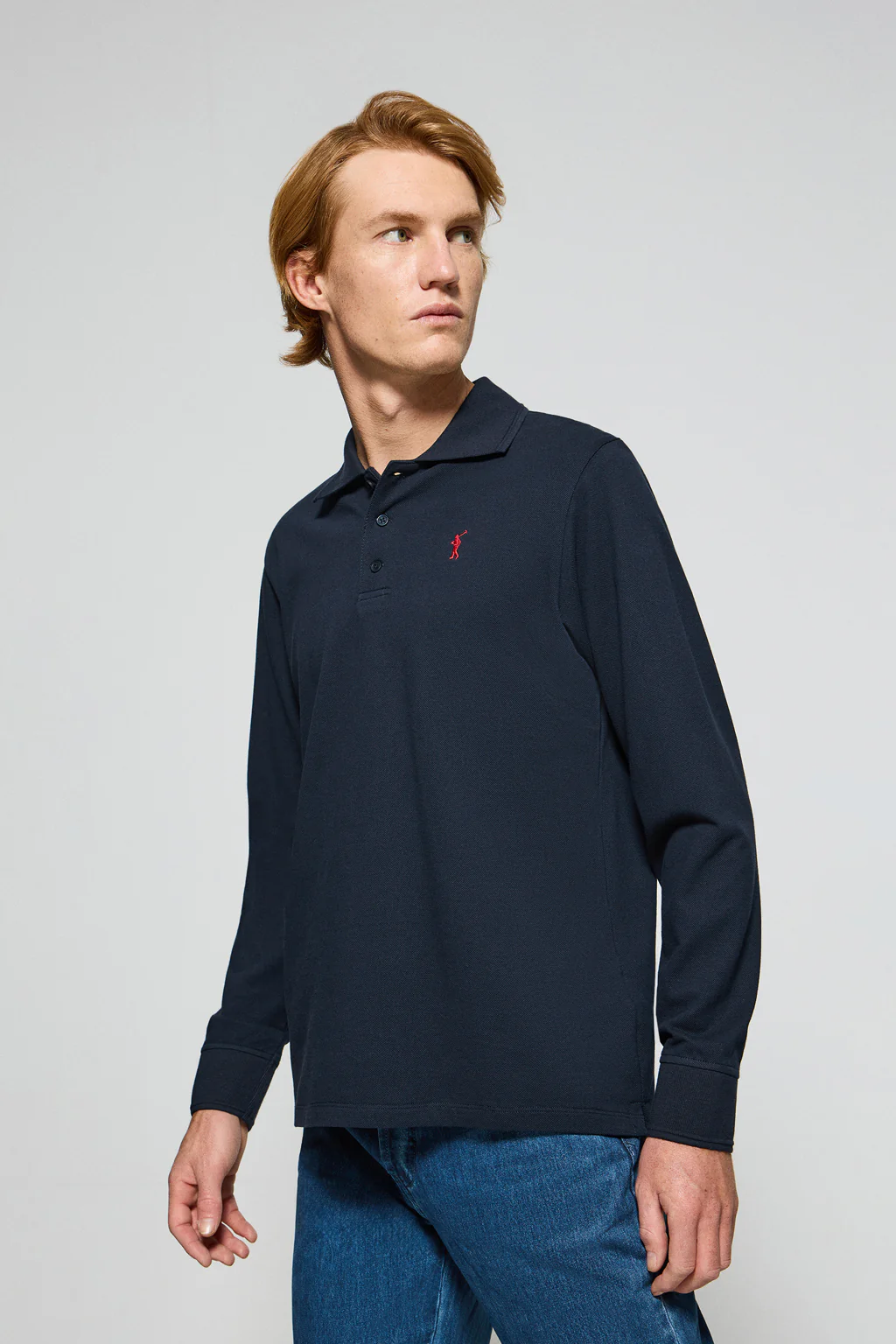 Polo de manga larga de tres botones en azul marino con logo Rigby Go