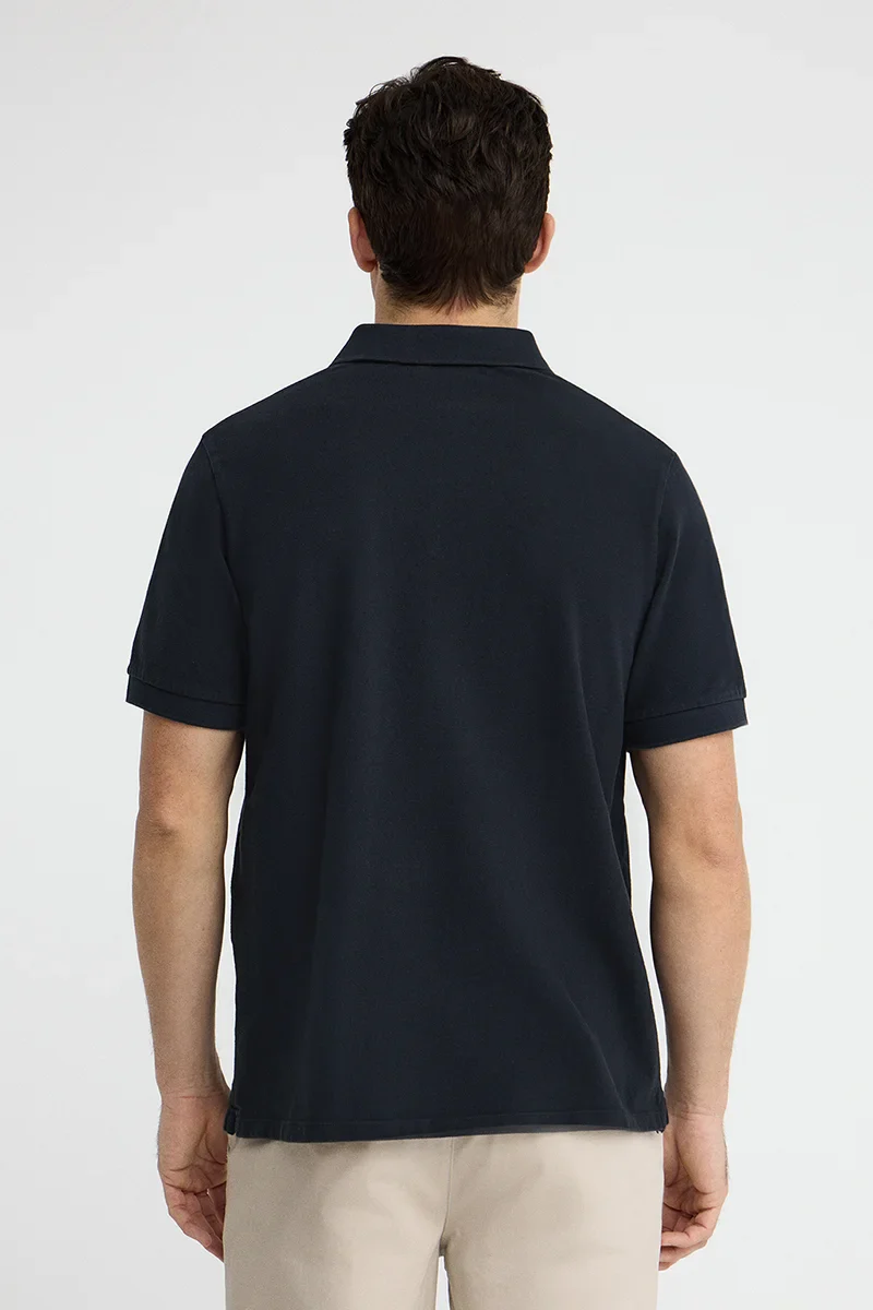Polo azul marino teñido en prenda con logo bordado Rigby Go - Image 5